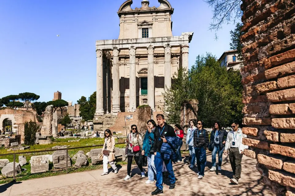 Upward view of the Colosseum arches from ground level